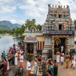 Kutchanur Saneeswara Temple Guide 2026: Timings, History & Luxury Travel Plan your 2026 visit to the Swayambhu Kutchanur Saneeswara Temple. Get accurate timings, Parihara details, and premium luxury car rentals from Theni/Madurai. Call 94430 04141 for VIP Pooja support. 🏛️ Kutchanur Saneeswara Temple: History & Significance The temple's history is steeped in ancient legends. It is said that King Dinakaran (or Chandravadana in some versions) was cursed with leprosy by Sage Durvasa. To seek redemption, the king performed intense penance on the banks of the Surabi River. Lord Saneeswara, moved by his devotion, appeared as a Swayambhu (self-manifested) idol and cured the king. Unlike the typical angry portrayal of Saturn, the Lord here is considered "Shanti Saneeswara"—a peaceful deity who grants boons to those who approach with a pure heart. ⏰ Temple Timings & Abishekaram (2026) The temple follows strict Vedic rituals. Saturdays are the most auspicious days, with extended hours to accommodate the thousands of devotees. DayMorning OpeningEvening OpeningSunday - Friday7:00 AM – 1:00 PM4:30 PM – 8:00 PMSaturday6:00 AM – 3:00 PM4:30 PM – 9:00 PM Daily Poojai & Abishekaram Schedule Ushakala Pooja: 5:30 AM – 6:30 AM Kalasandhi Abishekam: 9:00 AM – 10:00 AM Uchikalam (Noon Pooja): 12:00 PM – 1:00 PM Sayarakshai (Evening): 5:30 PM – 6:30 PM Artha Jama Pooja: 8:30 PM 🛤️ How to Reach & Luxury Travel Services Kutchanur is located 20 km from Theni and 100 km from Madurai. For a comfortable spiritual journey, Rengha Travels provides premium logistics. By Air: Madurai Airport (IXM) is the nearest international gateway. By Rail: Theni Railway Station is well-connected to Chennai and Madurai. Luxury Vehicle Service: We offer Innova Crysta, Fortuner, and Urbania rentals for families and groups. Doorstep Pickup: Pickup available from Madurai Airport or Theni Railway Station. Booking Contact: 📞 94430 04141 🕉️ Sanee Pariharangal & Palangal (Benefits) Devotees visit Kutchanur to mitigate the effects of Sani Peyarchi (Saturn Transit), specifically for Ezharai Sani, Ashtama Sani, and Kandaka Sani. Recommended Rituals: Ellu Deepam: Lighting lamps with sesame oil and black cloth seeds. Surabi River Dip: A holy bath in the perennial Surabi River before darshan. Crow Feeding: Offering rice to crows (Lord Shani's vahana). Black Cloth Offering: Offering black Vastram to the deity. Benefits (Palangal): Relief from prolonged health issues and financial debts. Success in career and legal matters. Mental peace and removal of "Drishti" (evil eye). 🎊 Major Festivals 2026 Sani Peyarchi (Transit Festival): The most significant event in 2026, marking Lord Shani's move from Aquarius to Pisces. Aadi Festival: Every Saturday in the Tamil month of Aadi (July–August) is celebrated with grand Abishekams. Sani Mahotsavam: Special poojas on Saturn-related nakshatras. ❓ Frequently Asked Questions (FAQ) Q1: What makes Kutchanur unique compared to Thirunallar? In Kutchanur, Lord Saneeswara is the primary deity (Moolavar) and is Swayambhu (self-created), whereas in Thirunallar, he is a sub-deity in a Shiva temple. Q2: Can I book pooja items in advance? Yes. Through our Pooja Support, we provide a complete kit (Sesame oil, black cloth, lamps) so you can avoid local market crowds. Call 94430 04141. Q3: Is there a dress code for the temple? Traditional attire is recommended. Men are usually required to wear dhotis or formal trousers, and women are encouraged to wear sarees or churidars. Q4: Do you provide "Fresh-up" rooms? Yes, our luxury packages include access to clean, air-conditioned rooms for bathing and changing before heading to the temple. Plan your visit today! 📞 Phone: 94430 04141 🌐 Website: saneeswaratemple.com 📍 Location: Kutchanur, Theni District, Tamil Nadu https://saneeswaratemple.com/guru-peyarchi-2026-date-jupiter-transit-2026-predictions-tamil